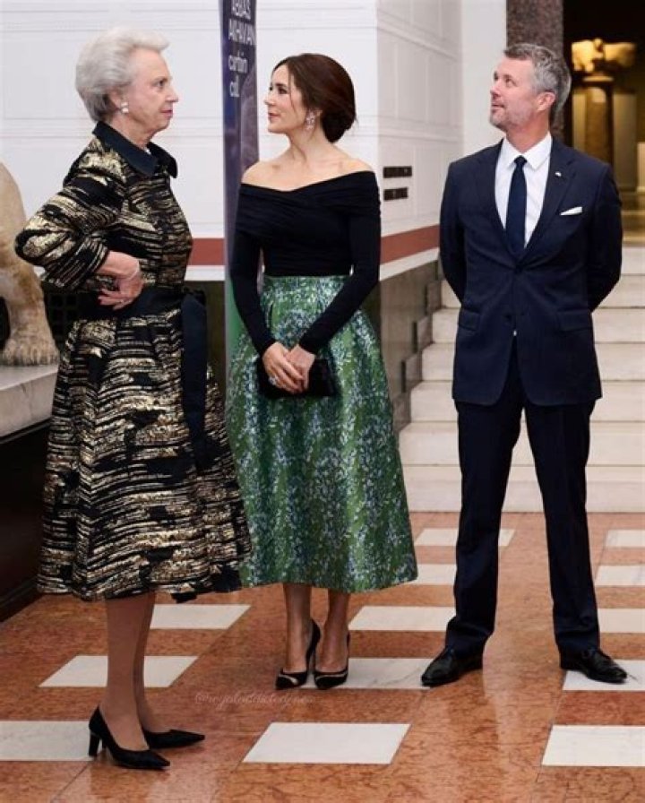 Crown Prince Frederik pictured holding hands with Princess Mary as they reunite with their children